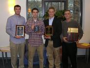Left to right: Francois Martin '12, Frank Campagnano '12, Bennett Weinerman '12 and Hamilton College men's soccer head coach Perry Nizzi at the presentation of postseason awards on Dec. 15.